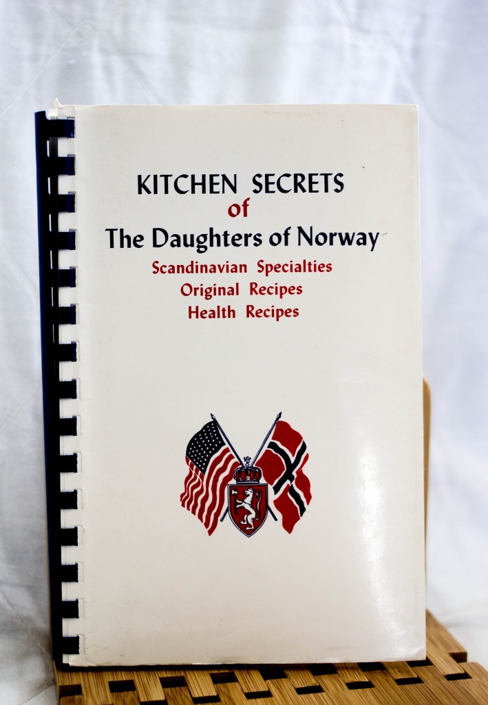 One of my mother's collected community cookbooks. Yes, we're from Norway. Photo Credit: Johnna Mathews, facebook.com/johnnamphotography