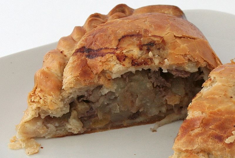A Cornish pasty made by Warrens cut in half. The filling is beef steak, potato, turnip and onion. Photo: David Johnson via Wikimedia Commons